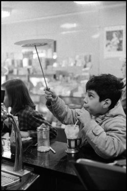 Boy plate-spinning, black and white